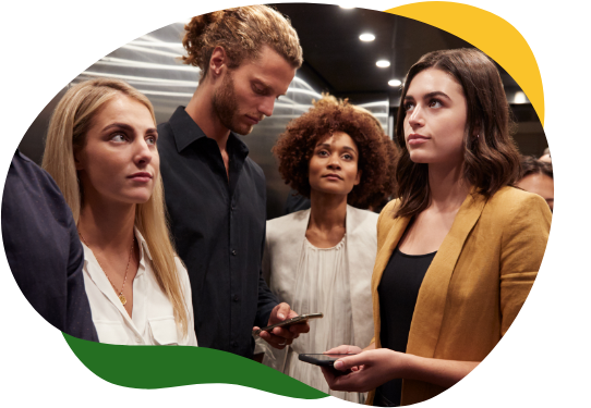 A group of four young professionals looking sheepishly in different directions or on their cell phones